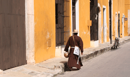 Franciscan monk walking through the streets of Izamal